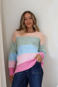 Cali Stripe Knit – model front shot with hand in pocket of dark blue jeans