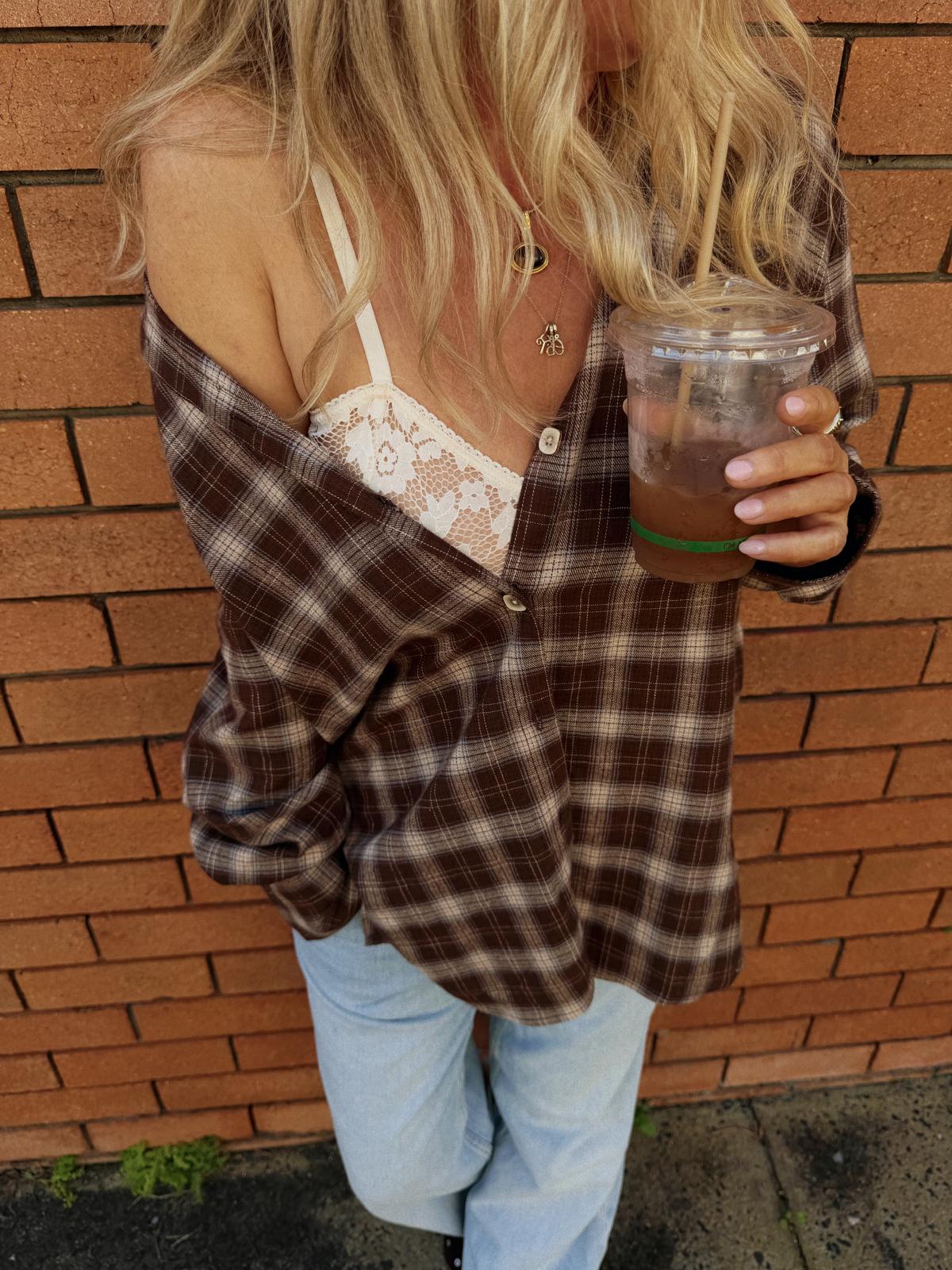 Jaase Canyon Austin Flannel Shirt chocolate by Jaase – close-up outdoor model shot with lace crop top underneath and light blue jeans
