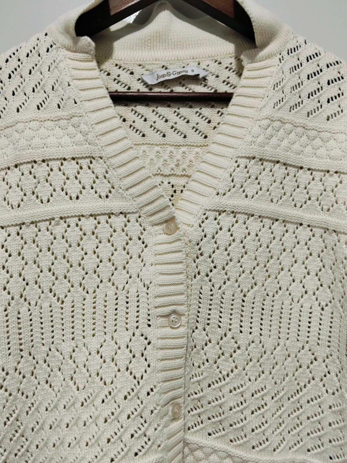 Cloud Dancer Crochet Cardigan natural cream – flat lay close-up of front showing pointelle crochet detail