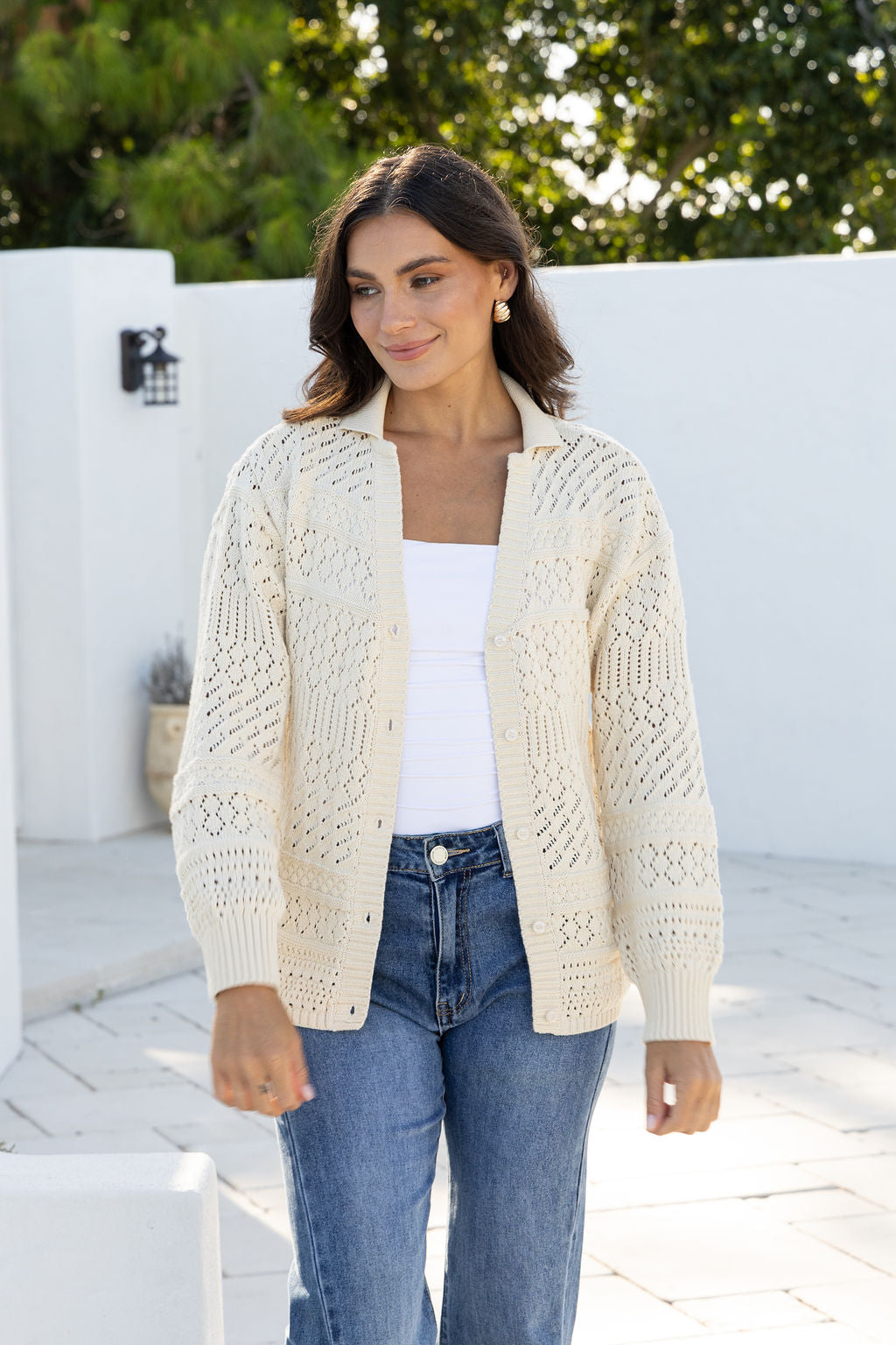 Cloud Dancer Crochet Cardigan natural cream by Joop & Gypsy – model outdoor shot styled with blue jeans