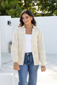 Cloud Dancer Crochet Cardigan natural cream by Joop & Gypsy – model outdoor shot styled with blue jeans