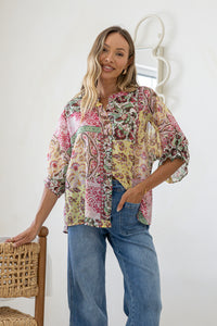 Marbella Blouse Paisley Pink print – model front shot paired with mid blue jeans