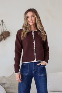 Praline Ribbed Blanket Stitch Cardi chocolate – model with hand in pocket of dark blue jeans
