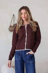 Praline Ribbed Blanket Stitch Cardi chocolate – model front view with hand in pocket
