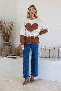 J'adore Heart Knit Jumper brown and cream – smiling model full length lifestyle shot with blue jeans