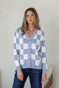 Monti Checker Knit Cardi powder blue and white – model front shot buttoned up with dark blue jeans