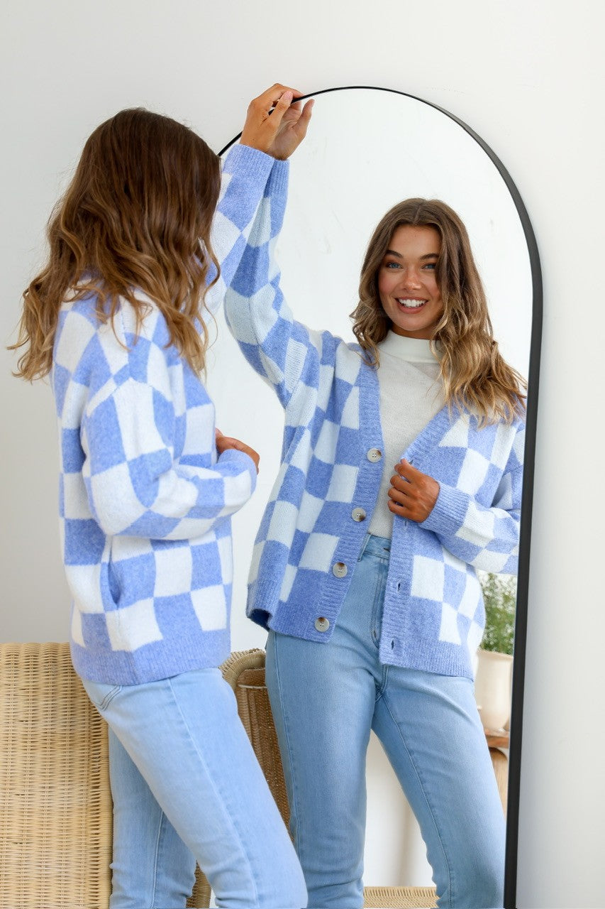 Monti Checker Knit Cardi powder blue and white – smiling model mirror shot looking towards camera
