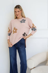 Sacha Daisy Knit Jumper blush – model lifting jumper to show hi-low hem length