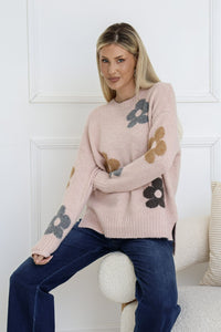 Sacha Daisy Knit Jumper blush – model sitting front view showing ribbed cuff sleeve detail