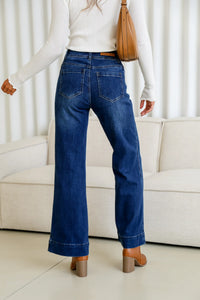 Sailor Wide Leg Pocket Jeans dark blue – model back shot styled with white top, tan boots and handbag
