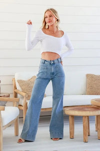 Sailor Wide Leg Pocket Jeans light blue – lifestyle shot styled with white crop top and heels