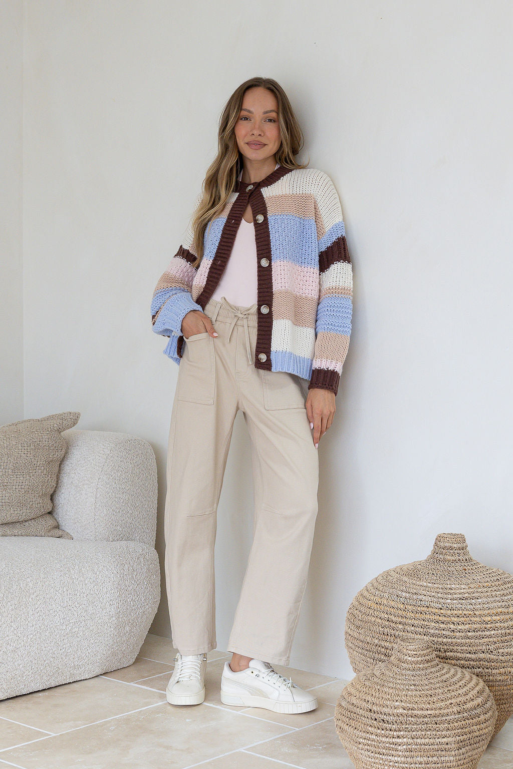 Model in Bastille Chunky Cardi blue stripe – styled with jeans and sneakers